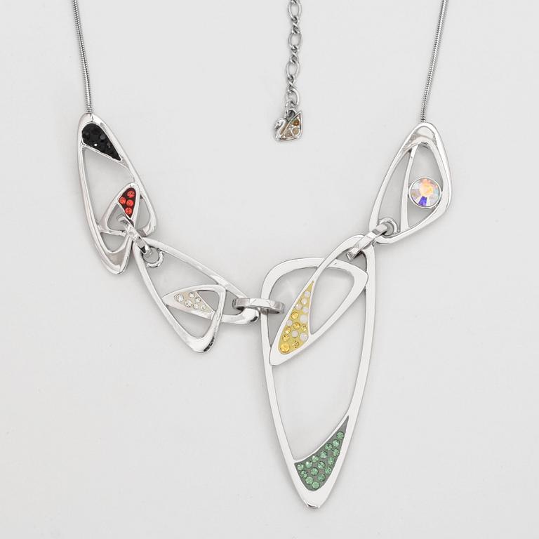 SWAROVSKI, a silver colored necklace and bracelet with swarovski crystals.