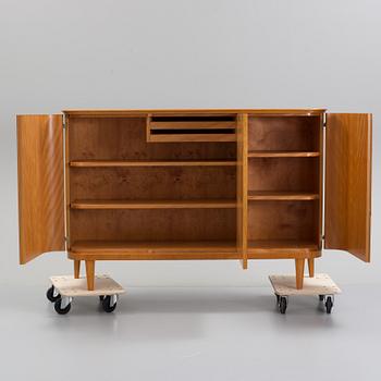 A Swedish Modern elm cabinet, 1930's/40's.