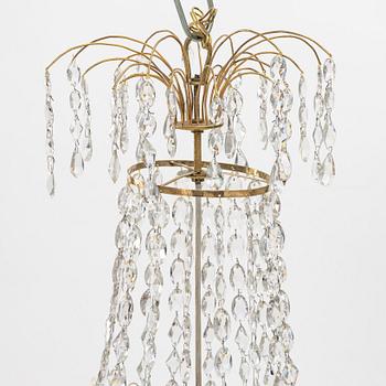 A Gustavian four-branch gilt-brass chandelier, Stockholm, late 18th century.