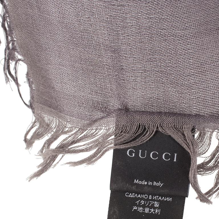 A shawl by Gucci.