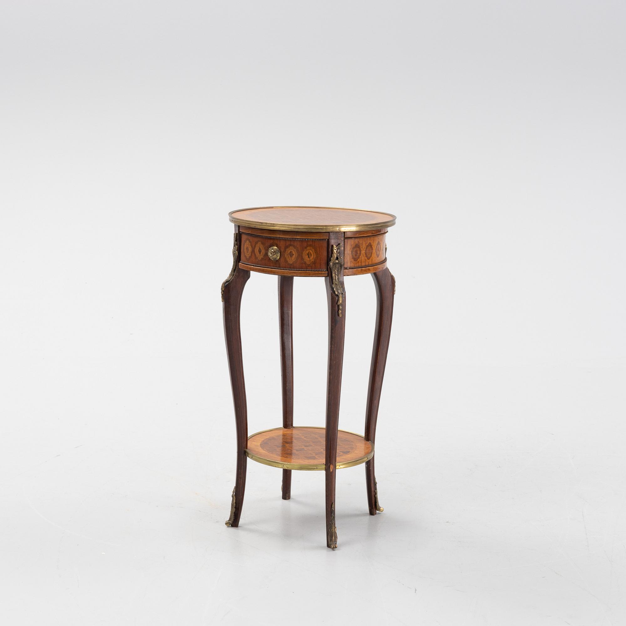 A rococo style table, circa 1900.