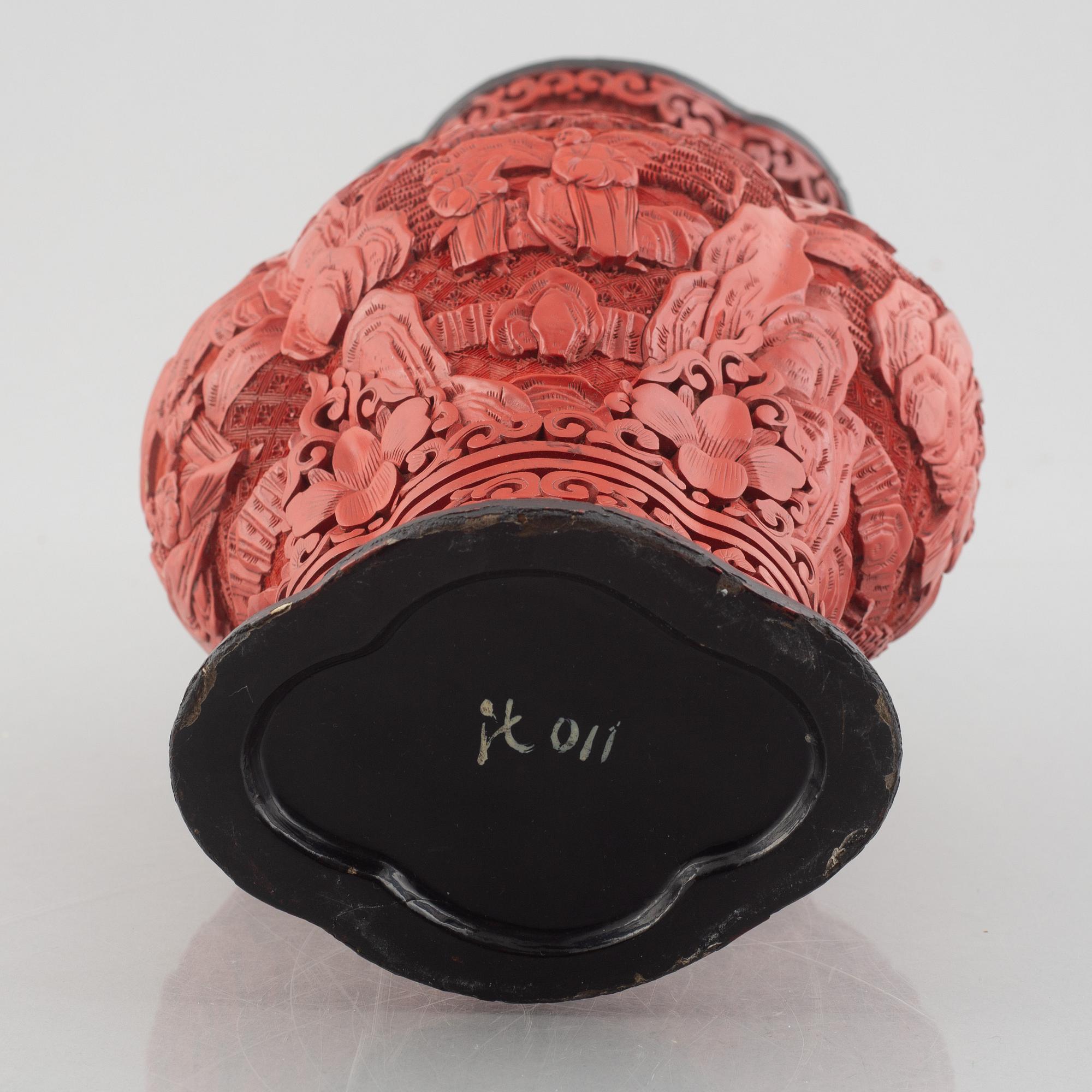 A red laquer vase, early 20th century.