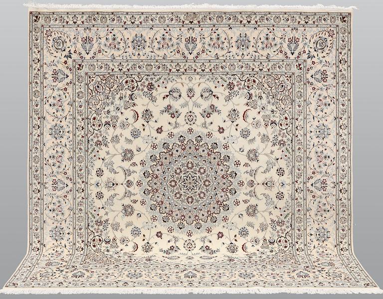 A Nain carpet, part silk, so called 6LAA, approximately 207 x 208 cm.