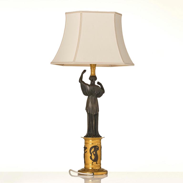 A French Empire ormolu and patinated lamp, early 19th century.