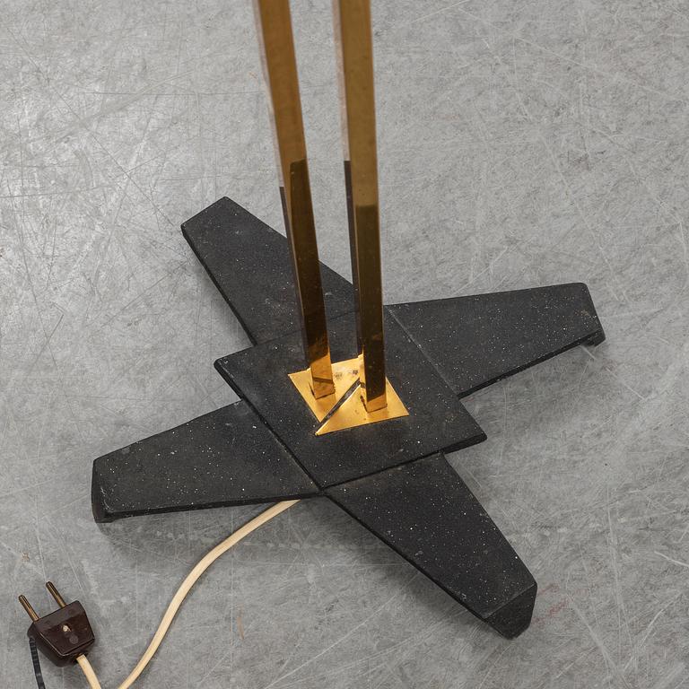 A 1950s brass and glass floor lamp.