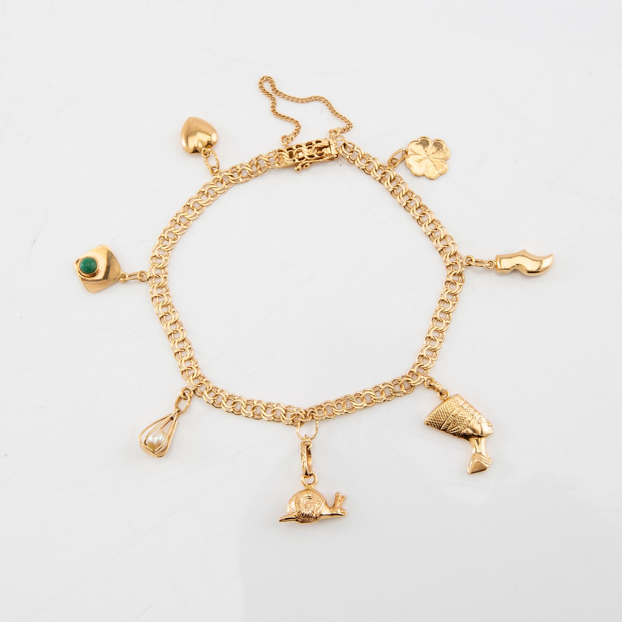 Armband Bismarck-länk 18K guld med berlocker.