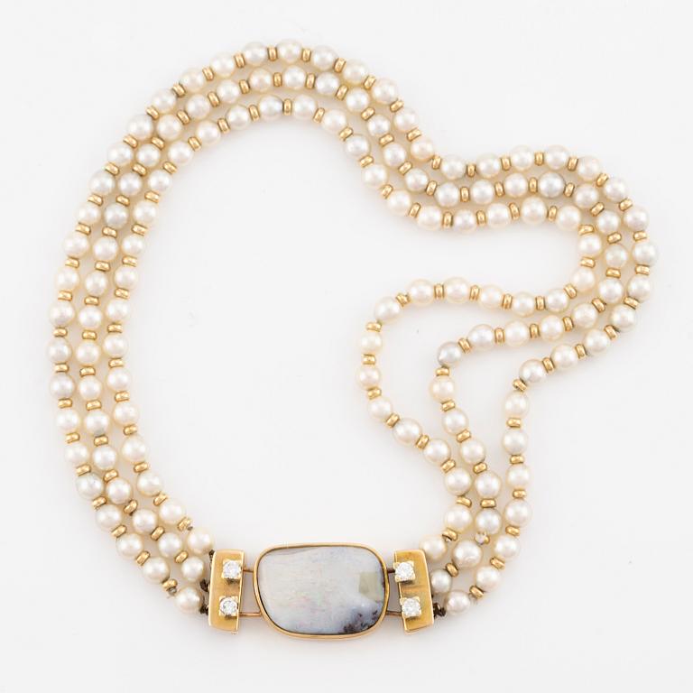 Necklace with cultured pearls, 14K gold clasp with opal and round brilliant-cut diamonds.