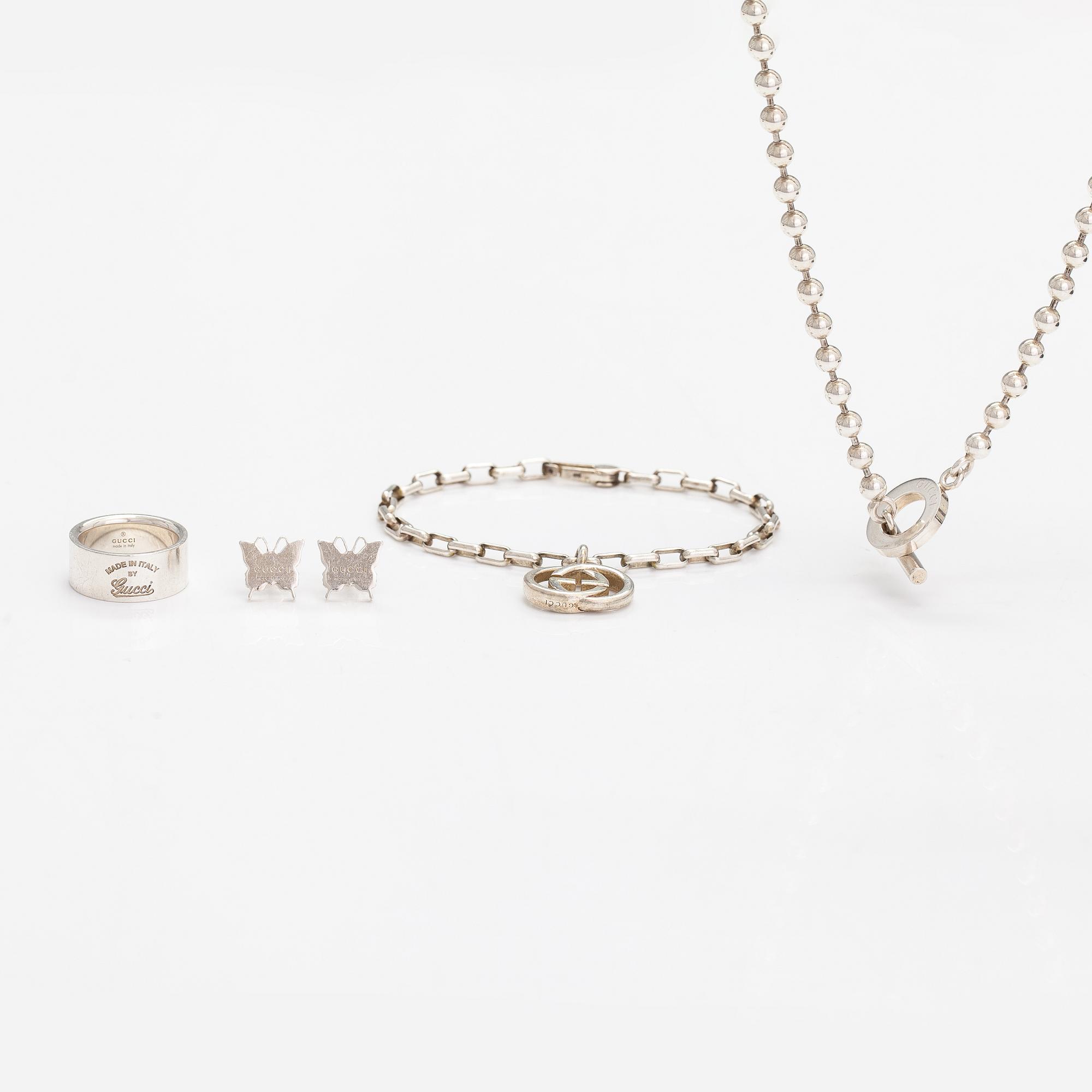 Gucci, A pair of earrings, bracelet, ring and necklace made of sterling silver. Marked Gucci, Made in Italy.
