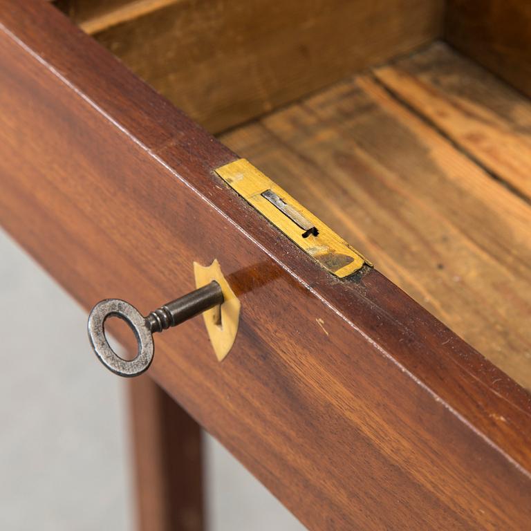 In the manner of the artist, a early 19th century late Gustavian table veneered with mahogany.