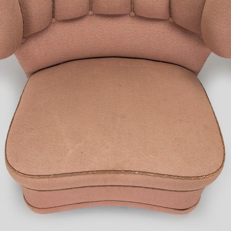 A pair of mid-20th century armchairs.