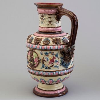 A creamware jug, circa 1900.