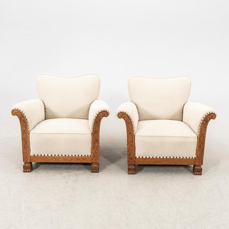 A pair of easy chairs from the first half of the 20th century.