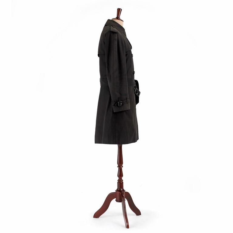 BURBERRY, a black cotton trenchcoat.