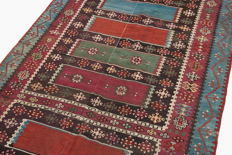 An antique Anatolian kilim, c. 374 x 148 cm.