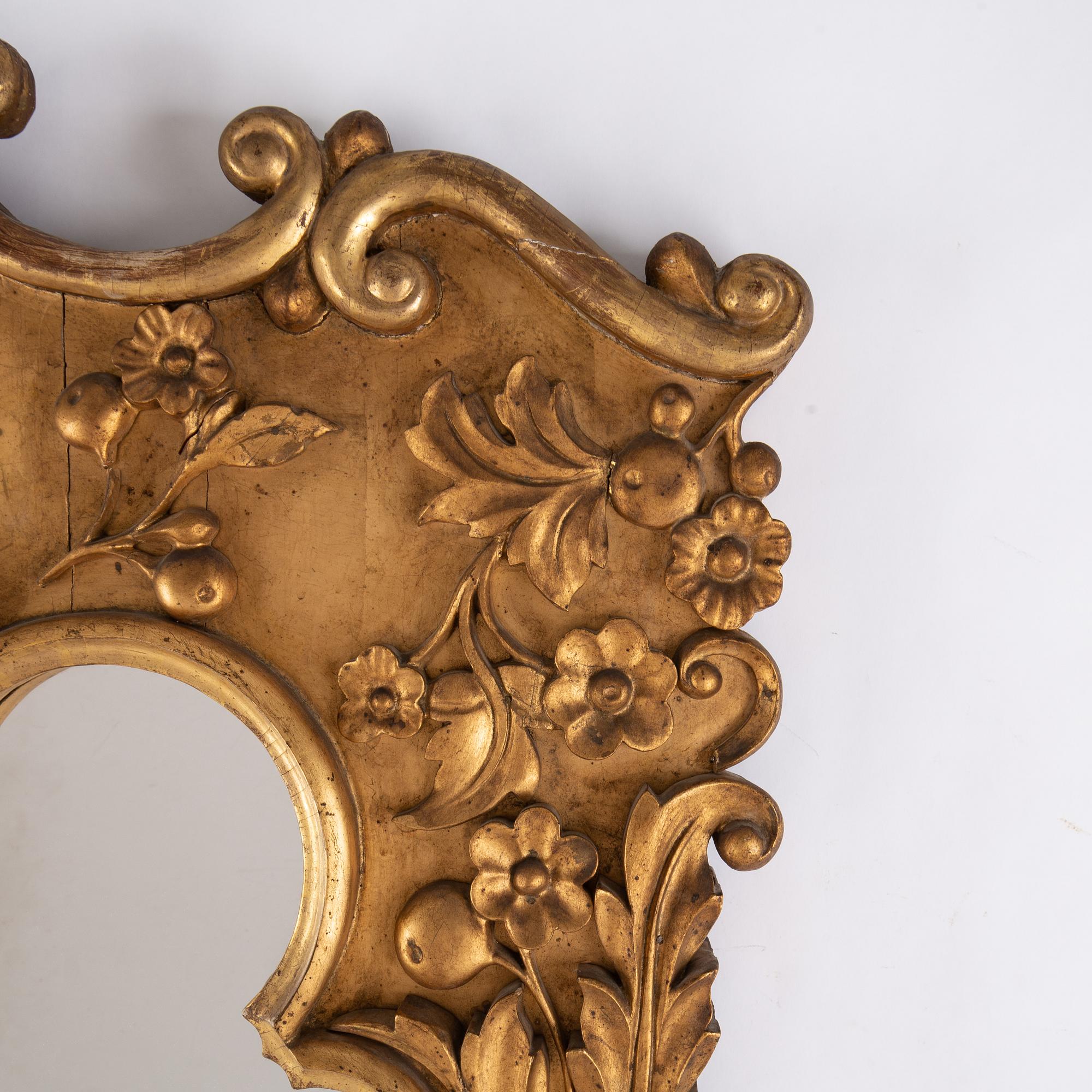 A late 19th century bronzed mirror.