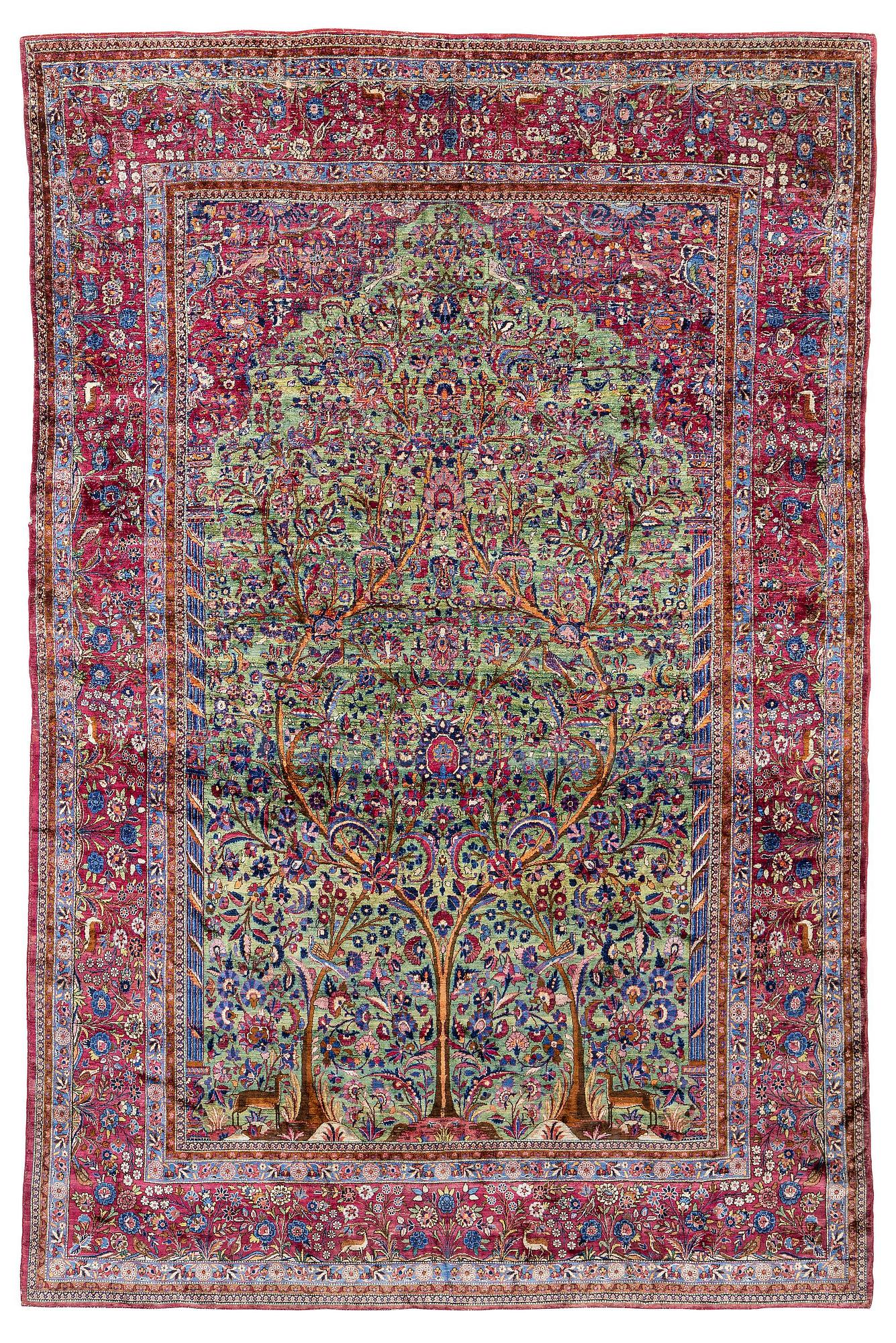 An antique silk Kashan carpet, central Persia, c. 319 x 206 cm.