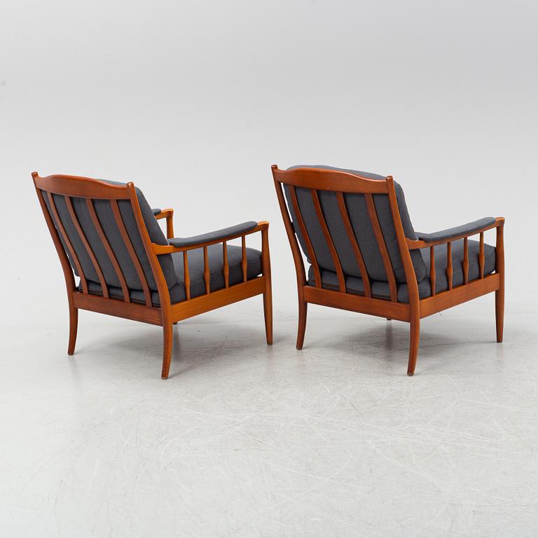 A pair of Swedish stained beech easy chairs, second half of the 20th Century.