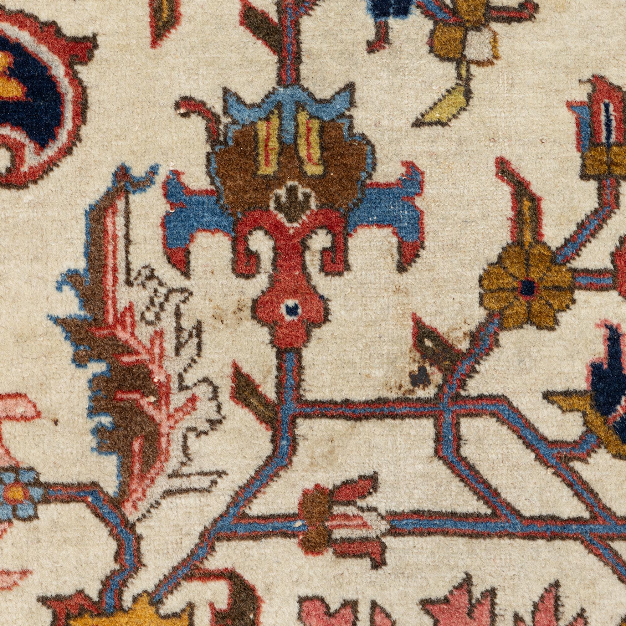 An antique Tabriz carpet, c. 365 x 280 cm.