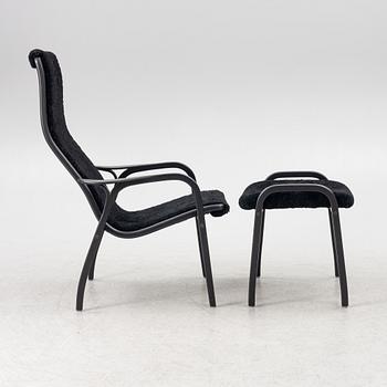Yngve Ekström, a  'Lamino' easy chair with foot stool, Swedese, 2018.