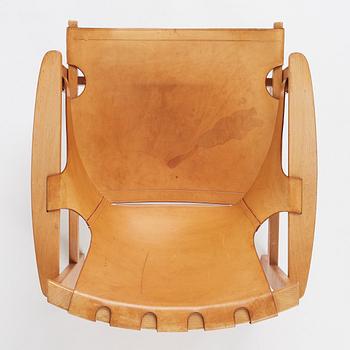 Carl-Axel Acking, a Swedish Modern oak and natural brown leather 'Trienna' chair, Nordiska Kompaniet.