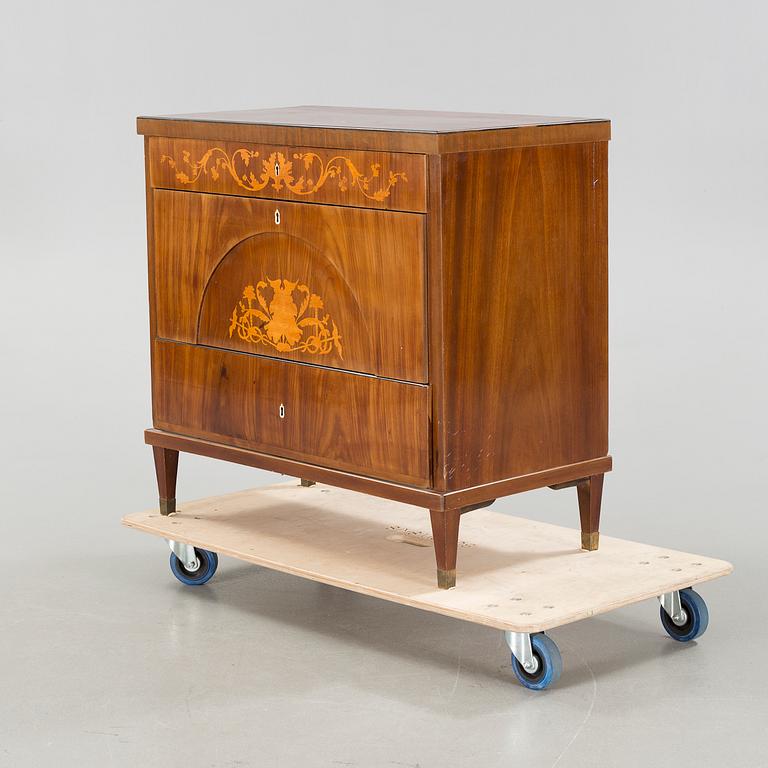 An empire chest of drawers, 19th century.