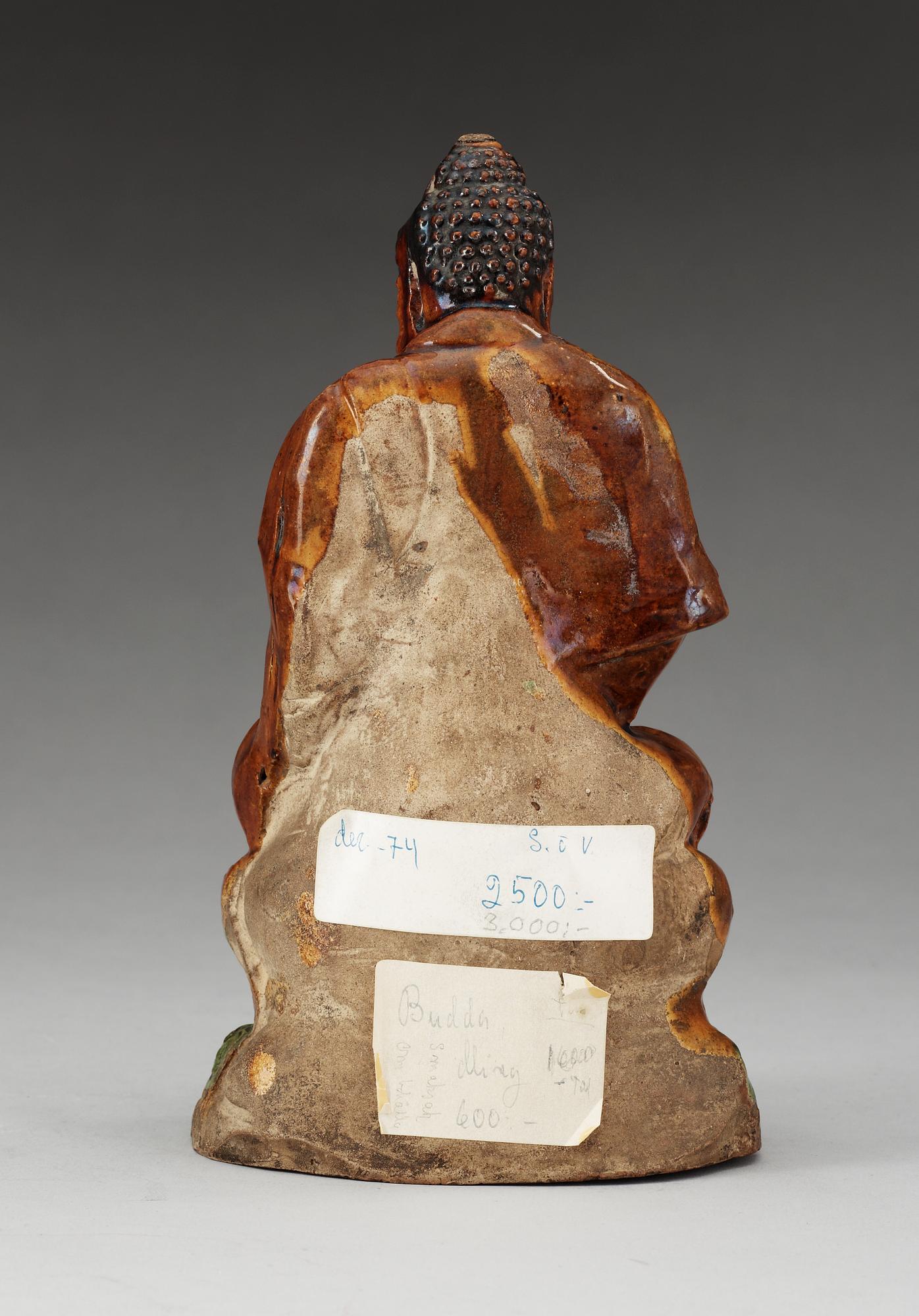 A ceramic figure of Buddha, Ming dynasty, 17th Century.