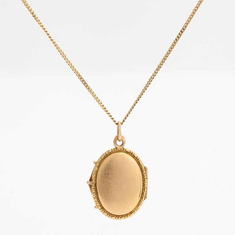 A 14K gold necklace with a locket and a syntetic ruby. Soviet Union.
