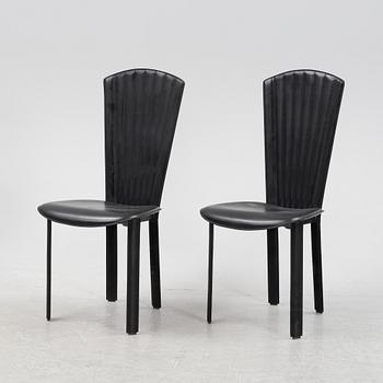 Twelve black leather 'Sossano' chairs, Quia, Italy.