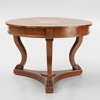 A mahogany veneered Empire style table, first half the 20th Century.