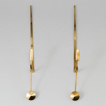 A pair of brass wall candle holders by Pierre Forsell, Skultuna.