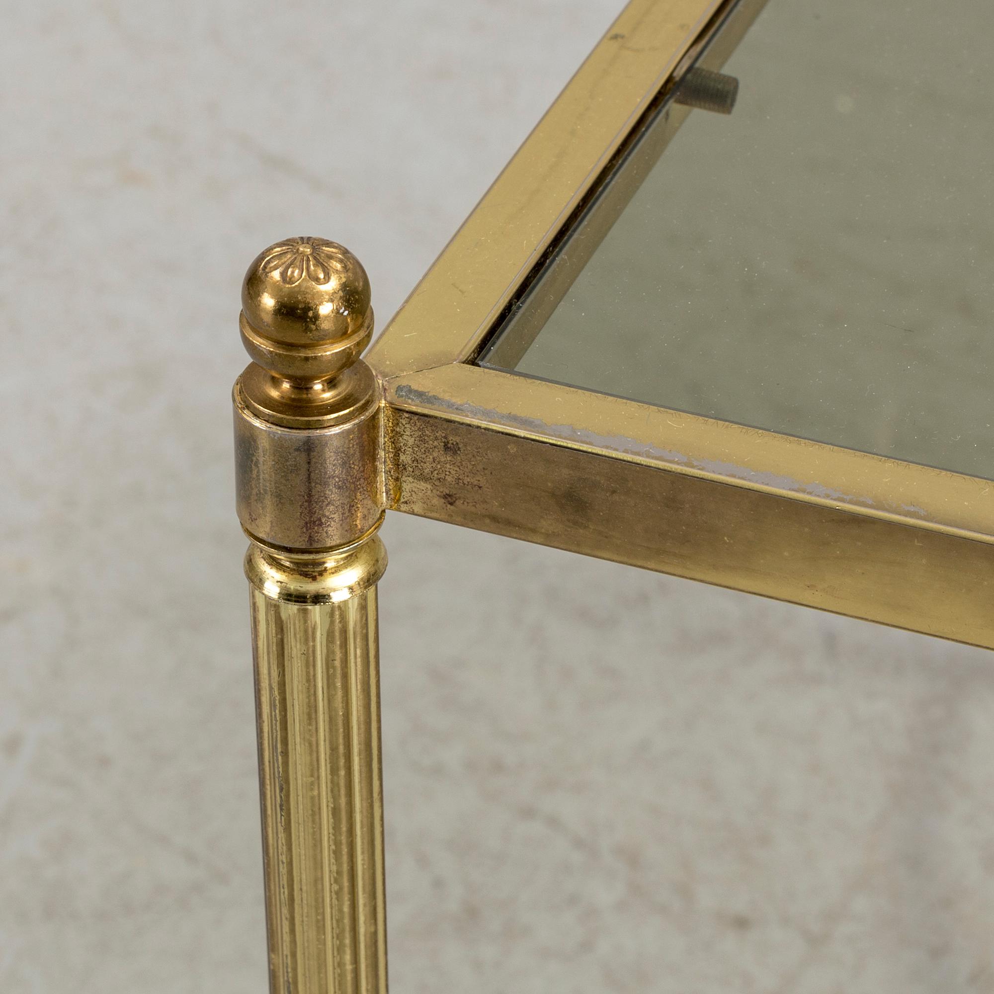 A brass and glass coffee table from the second half of the 20th century.