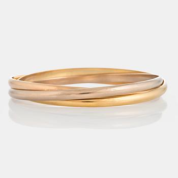 1036. A Cartier "Trinity" bangle.