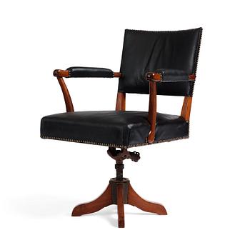 314. Josef Frank, a mahogany and black leather swivel chair, modified version of model 695, Svenskt Tenn, ca 1956-1957.