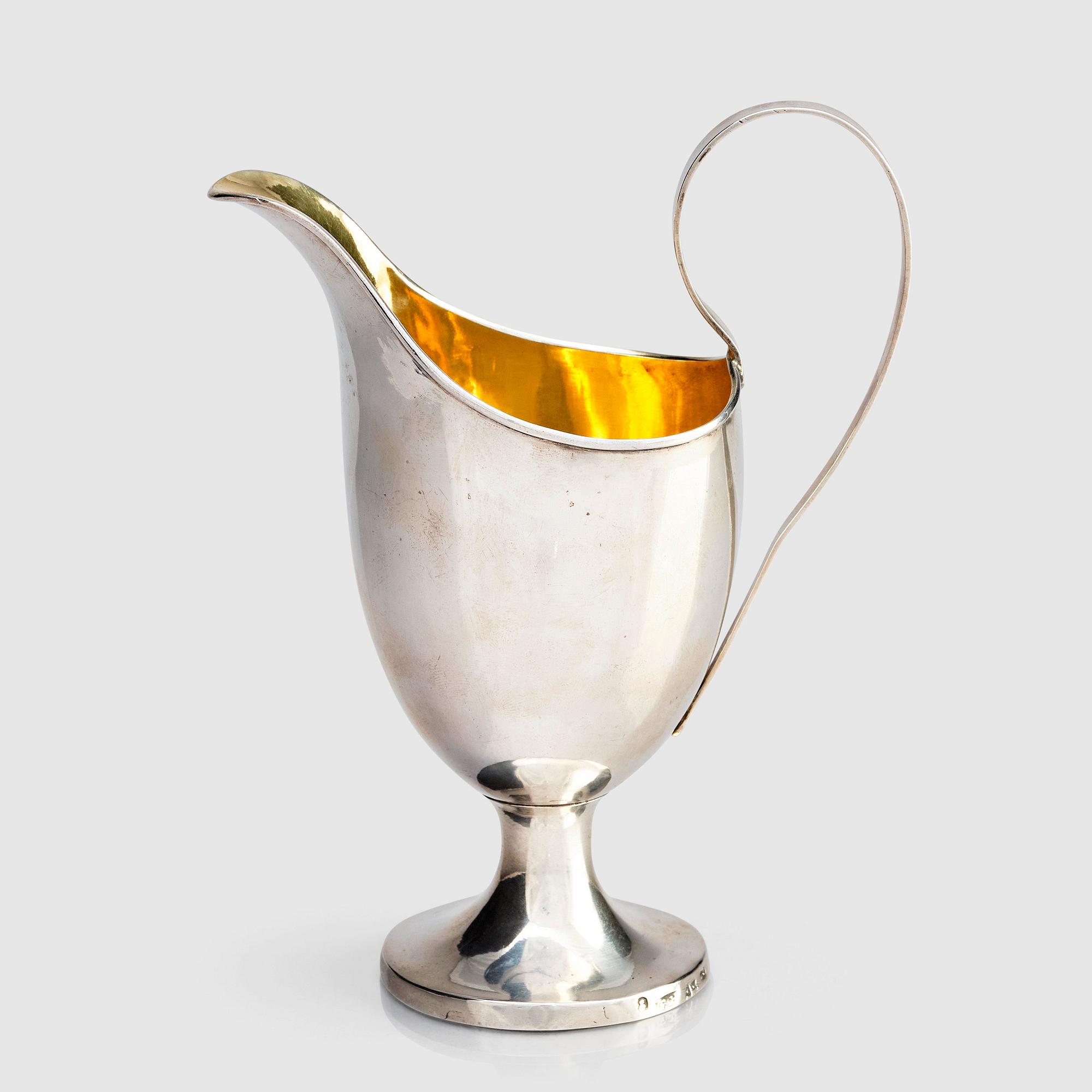 A Swedish parcel-gilt silver cream-jug, mark of Gustaf Hagström, Stockholm 1807.