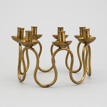 A mid 20th century brass candlestick by Nordiska Kompaniet NK.