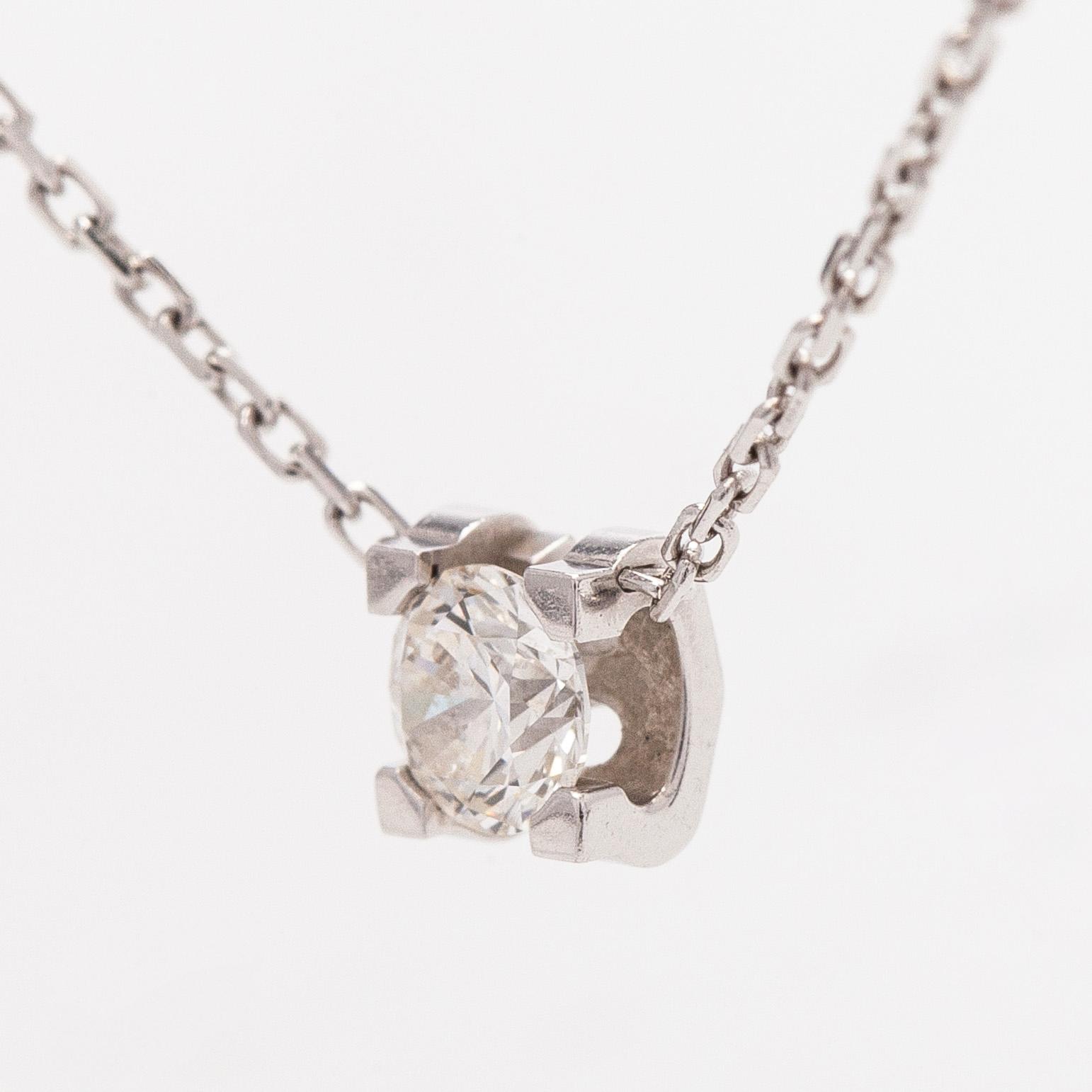 Cartier, an 18K white gold 'C de Cartier' necklace with a brilliant-cut diamond.