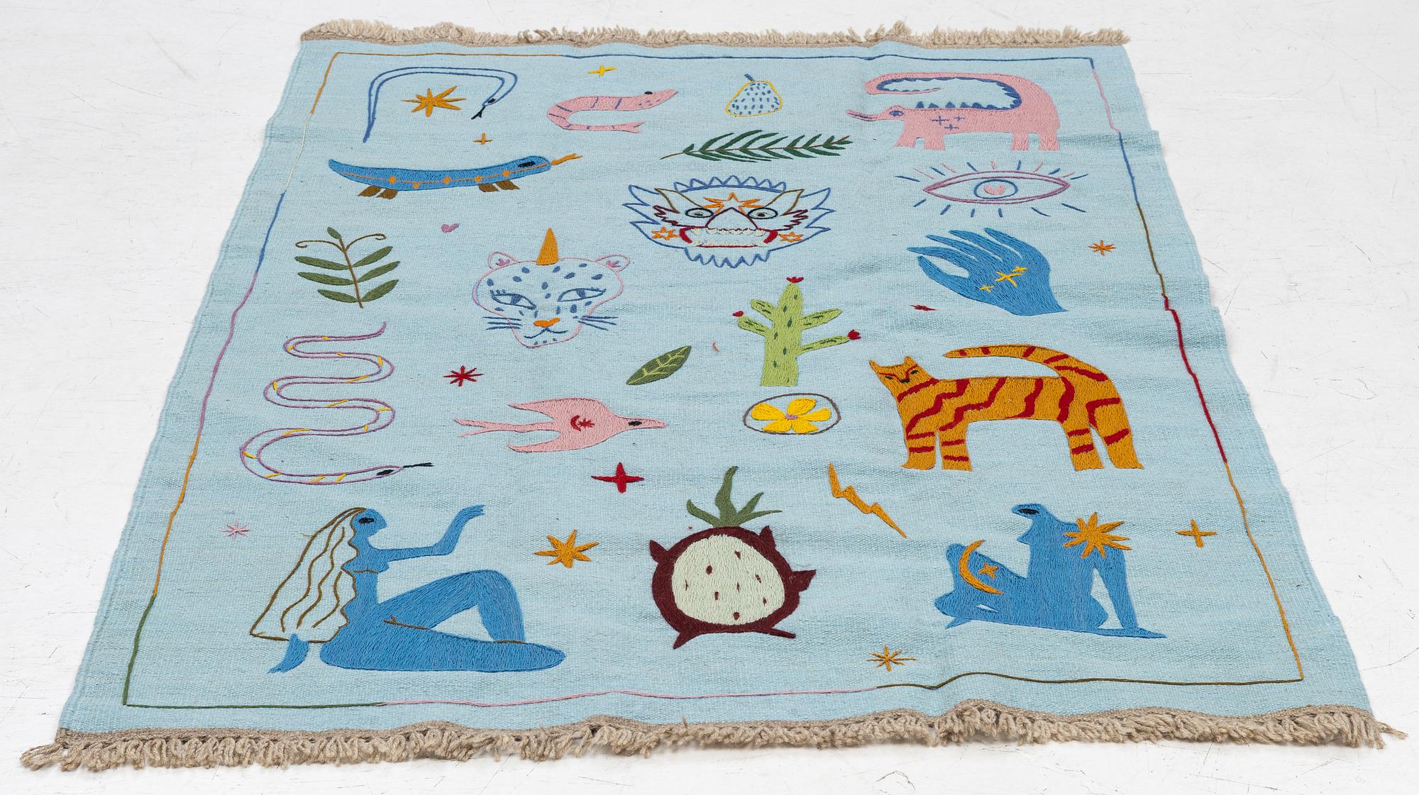 A hand-embroidered kelim rug, c. 189 x 126 cm.