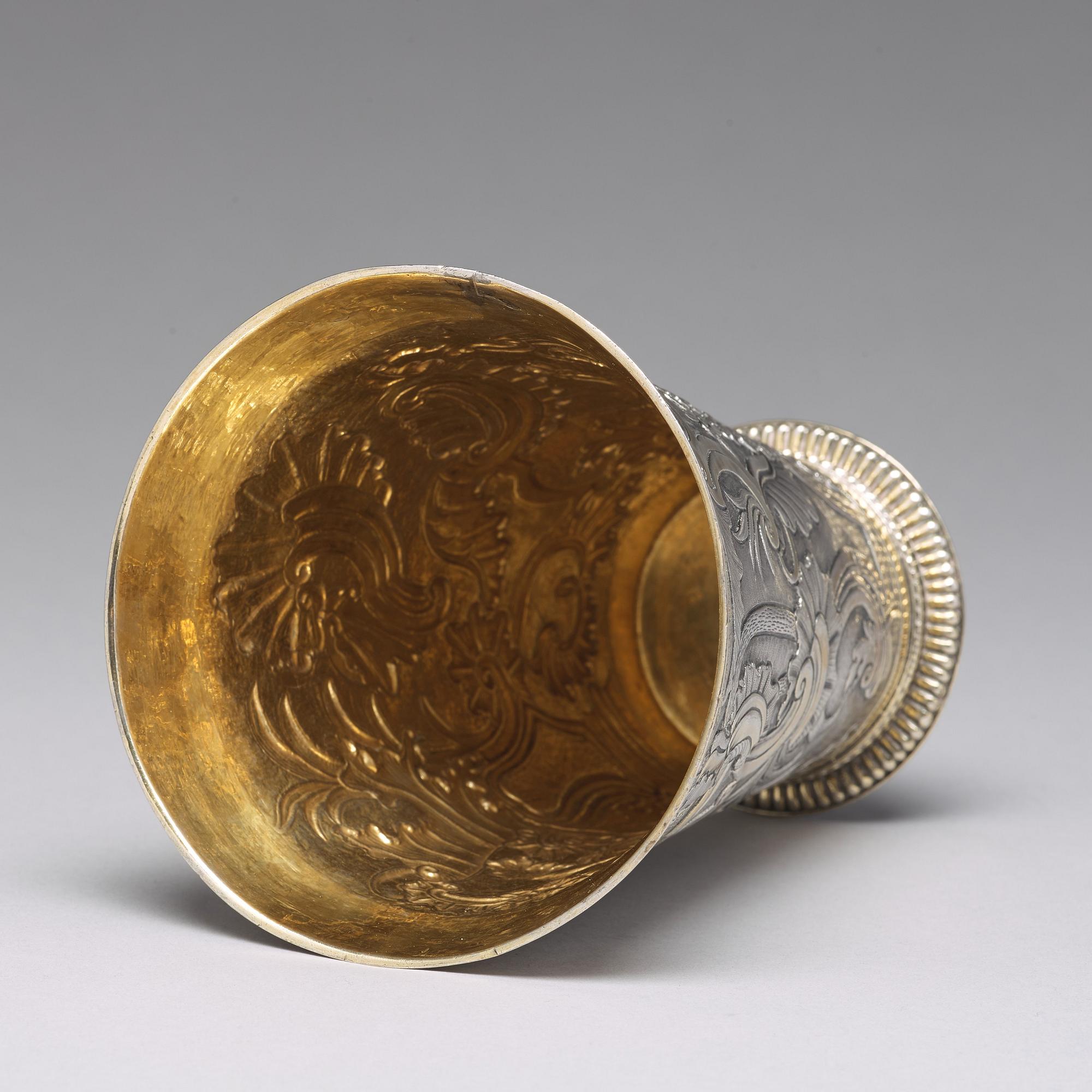 A Russian 18th century parcel-gilt silver beaker and cover, mark of Grigorij Poltow, Moscow (1755-1768).