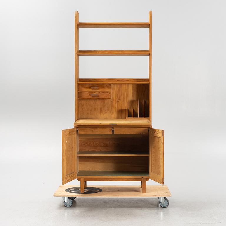 Göran Malmvall, a pinewood book case with secretaire and cabinet, second part of the 20th Century.
