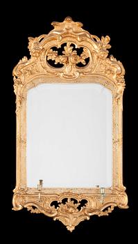 525. A Swedish Rococo 18th two-light girandole mirror.