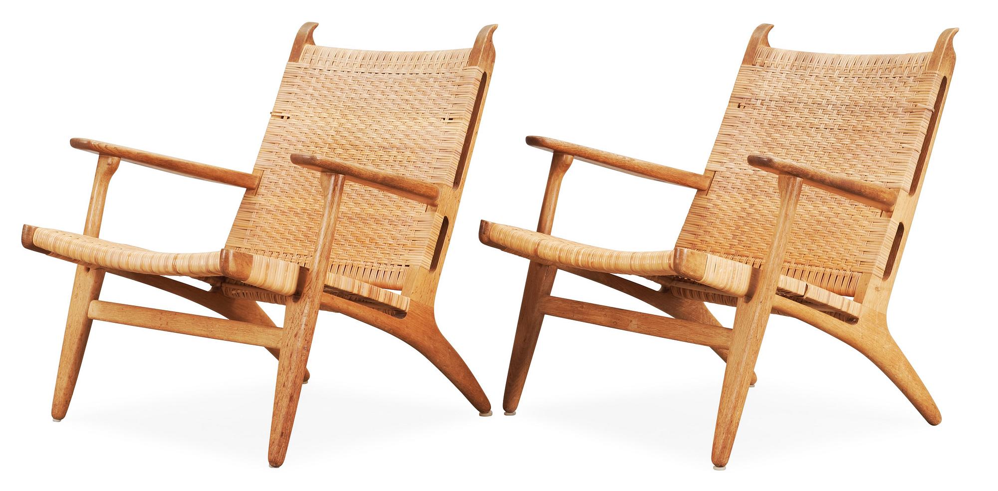 A pair of Hans J Wegner oak and rattan 'CH-27' armchairs, Carl Hansen & Son, Denmark, 1950's-60's.