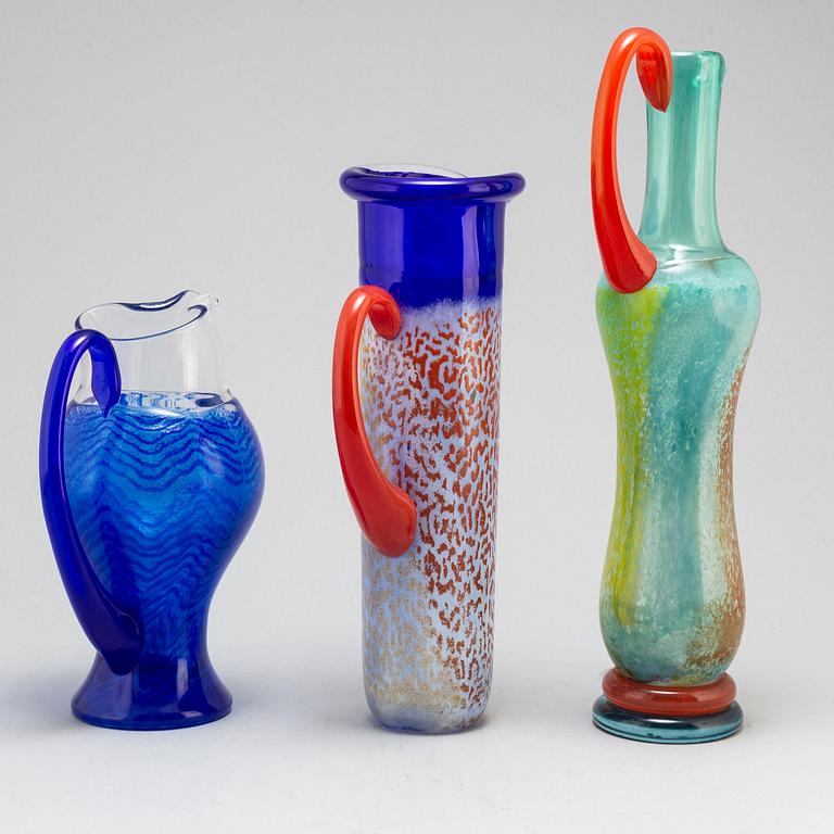 KJELL ENGMAN, three glass pitchers, signed, for Kosta Boda.