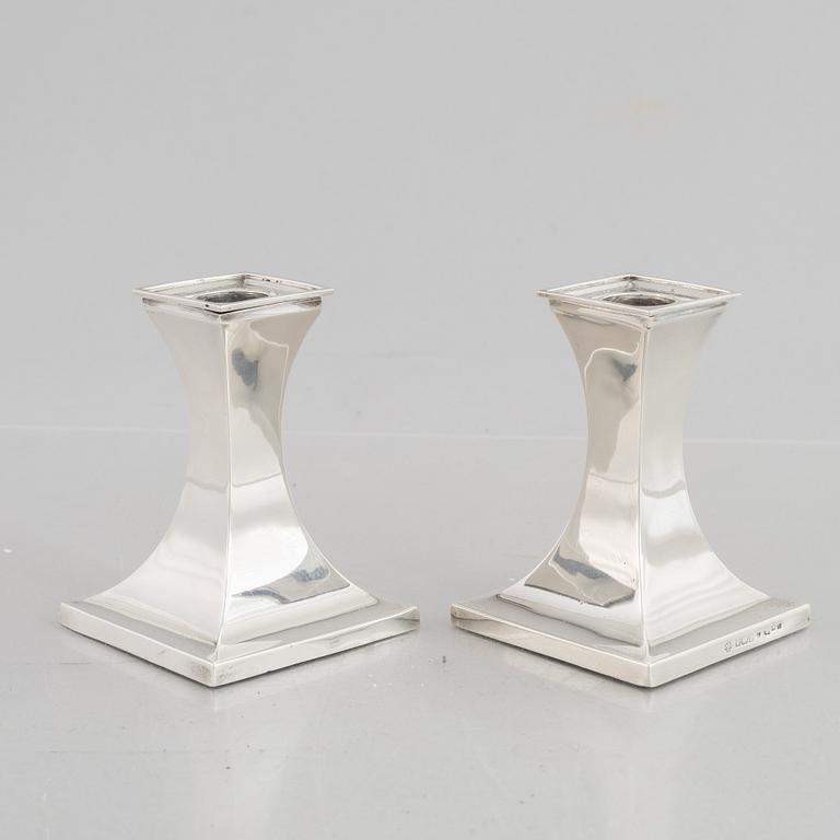 A pair of silver candlesticks, mark of William Hutton & Sons Ltd, Sheffield 1911-1912.