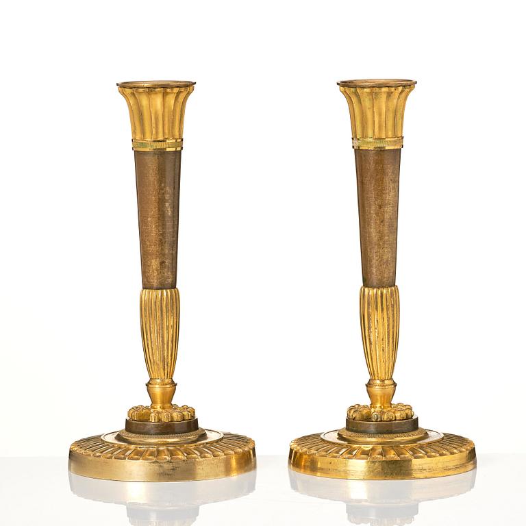 A pair of Empire candelsticks.