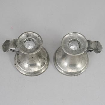 A pair of 19th century pewter candlesticks.