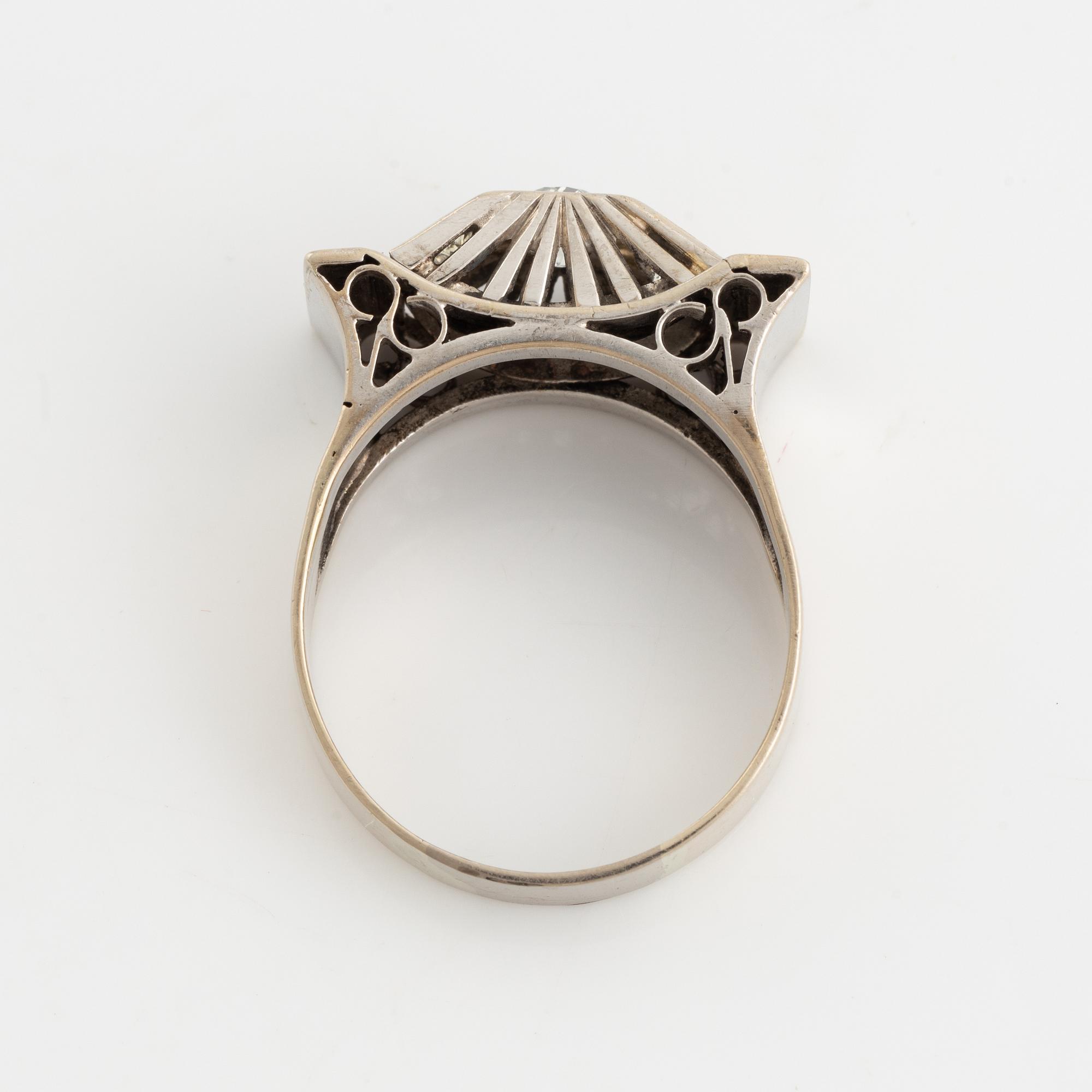 A 14K gold ring set with old-cut diamonds.