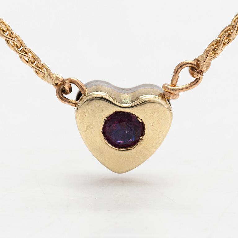 A 14K gold necklace, heartpendant with a sapphire and ruby. Finnish import marks.