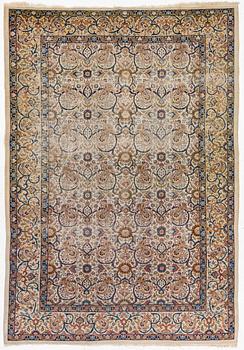 A Tabriz carpet, semi-antique, c. 330 x 230 cm.