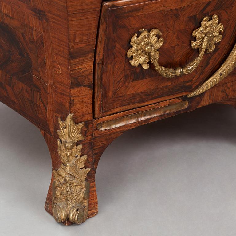 A Swedish early rococo parquetry, ormolu-mounted and marble commode, presumably by S. Pasch or J. Wulf , ca. 1740.