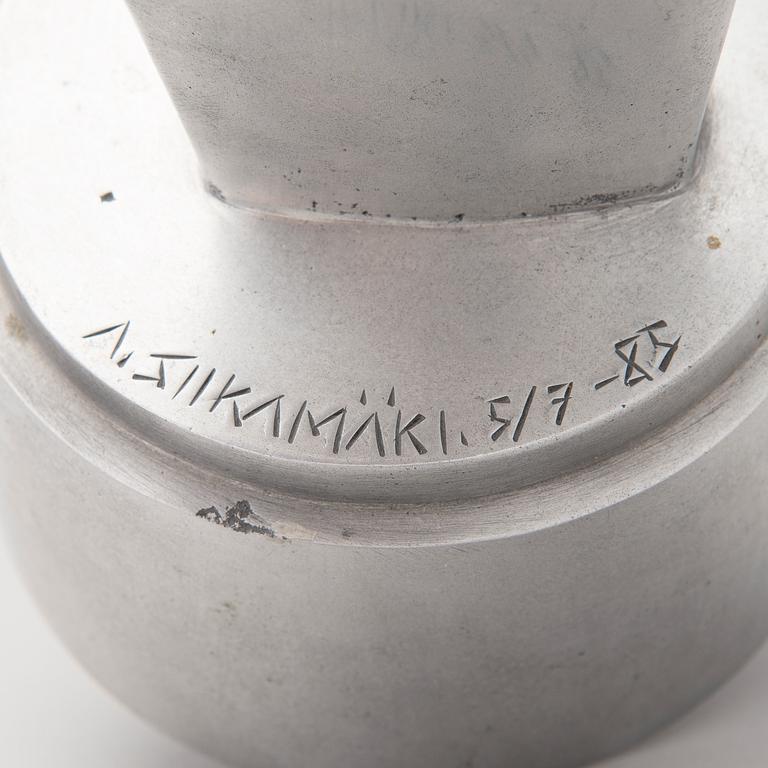 An aluminium sculpture, signed and numbered 5/7, dated -85.